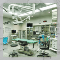 Cleveland Clinic, Twinsburg, Modern Operating Room: bright Steris lights, Operating table and chairs, backwall glass cabinetry.